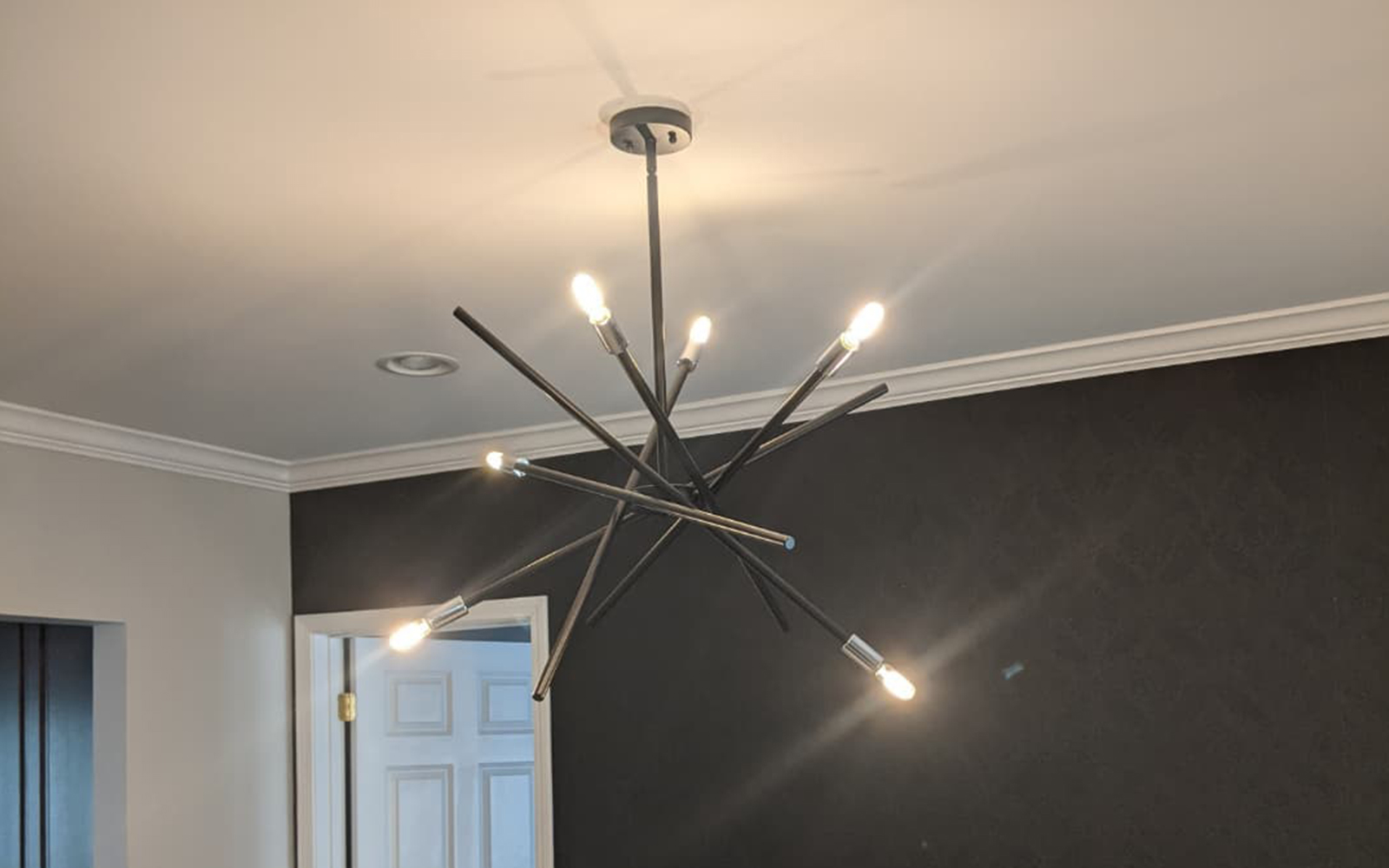 Professional handyman installing furniture in modern Chicago home