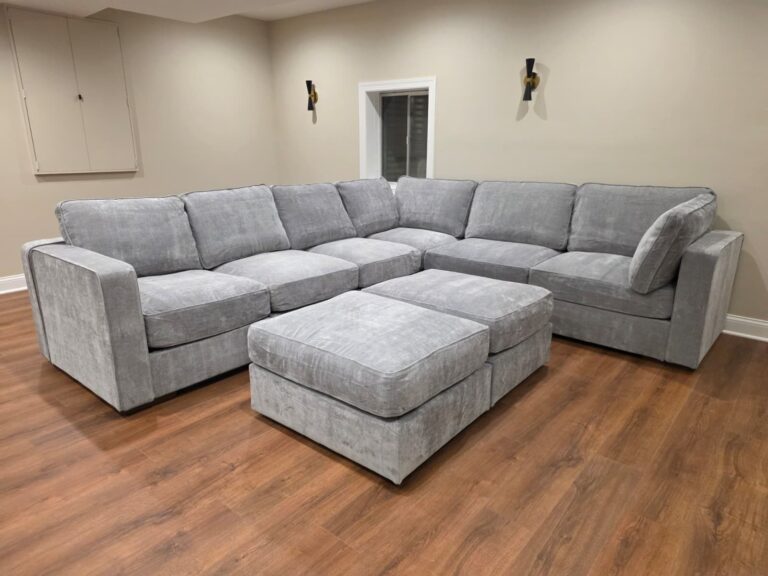 Finished Lovesac Sactional and ottomans in a basement family room