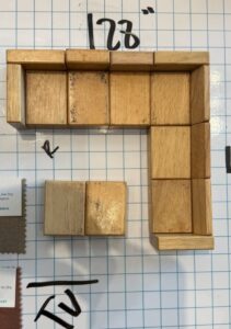 Sactional layout planned with blocks on a grid: a 128-inch wall, the TV opposite